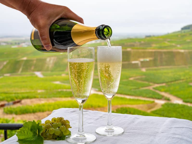 tasting of french sparkling white wine with bubbles champagne on